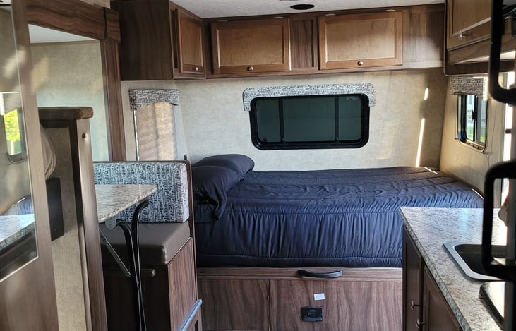 pick up the handle under the mattress to find a big storage area for your suitcases