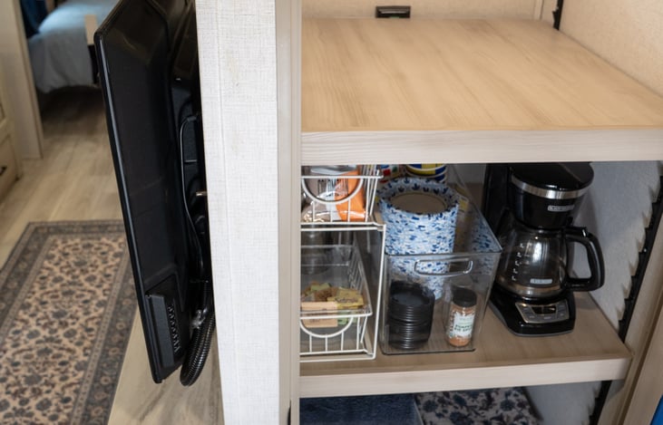 Fully stocked pantry includes coffee maker, coffee, creams and sugars, spices, disposable dishes and utensils, towels, beach towels, and kids games, toys, and books, with plenty of room to spare.