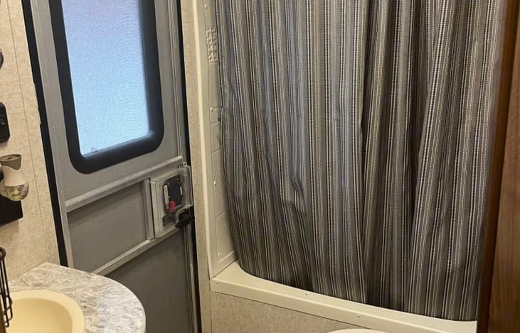 Shower with bathtub.