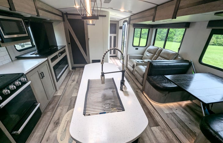 Spacious galley and fully-equipped kitchen. Plenty of room for everyone. Private bunkhouse and private bedroom on opposite ends. Pop-up TV to keep everyone entertained. Ample storage.