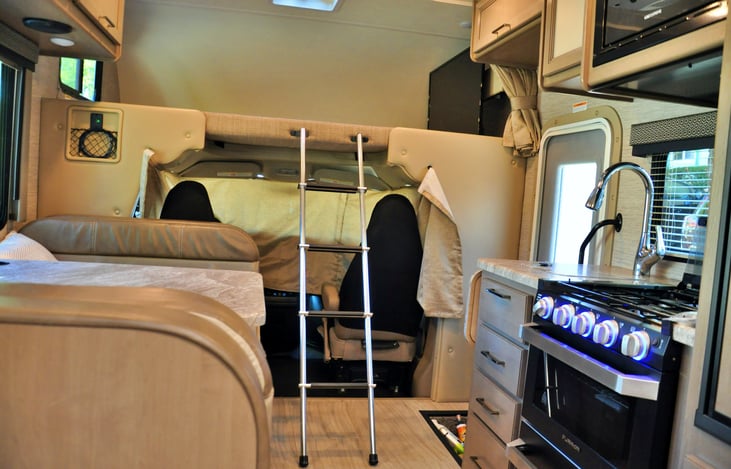 Overhead bunk, kitchen and dining