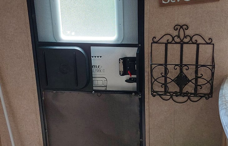 Door with rack for sink covers.