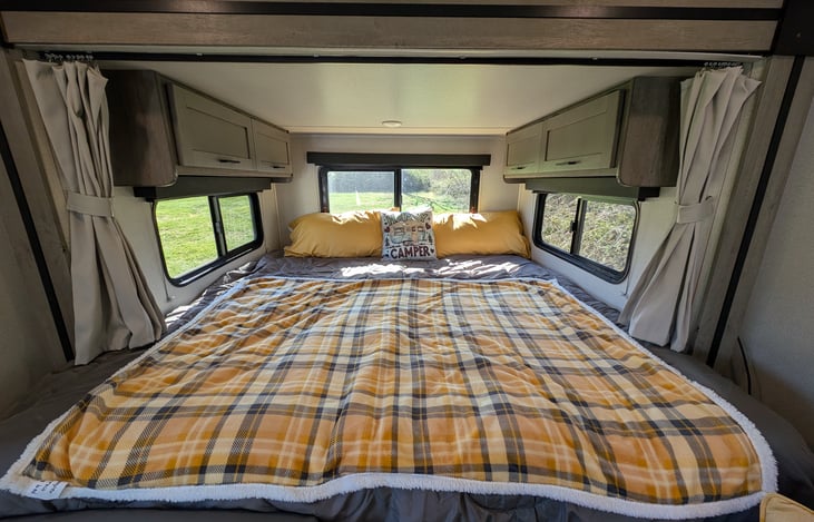 Large slide at the back has a cozy King bed.