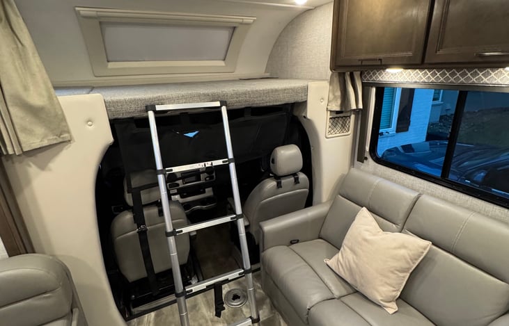 View showing the divider curtains on each side of the bunk, and the location of the ladder when attached to the bunk. Ladder can be removed and easily reattached as needed.