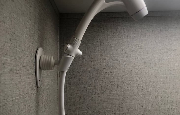 Shower head with on/off switch to conserve water