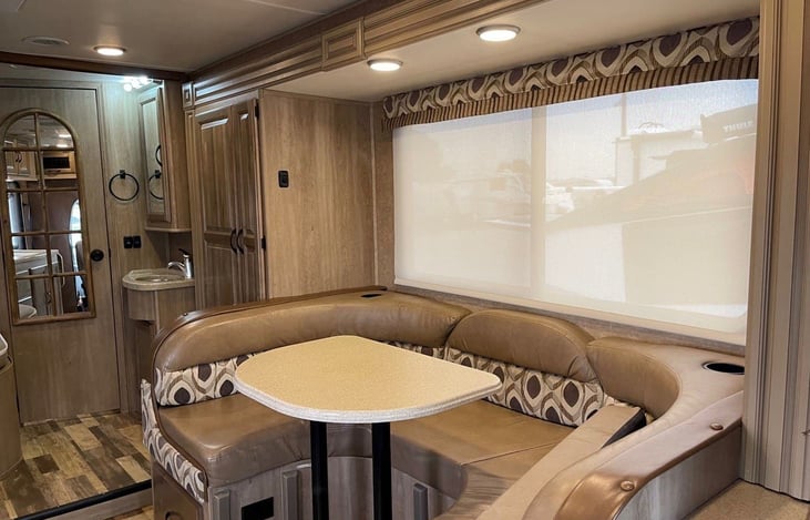 Dinette seats 3. Driver and passenger seat swivel to a table.