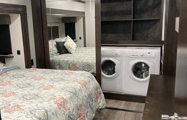 Master with king bed, walk in closet, dresser, tv, washer and dryer.