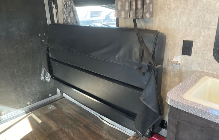 Leather couch and twin bed