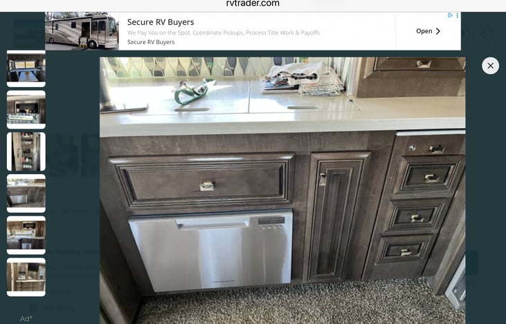 Kitchen area that slides out when parked for camping. Includes a dishwasher induction stove top, microwave/ convection oven. Plenty of food storage here also. includes a reverse osmosis water filter