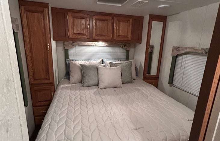 Queen Bed in the master bunkroom with sliding door that offers privacy from the main cabin.