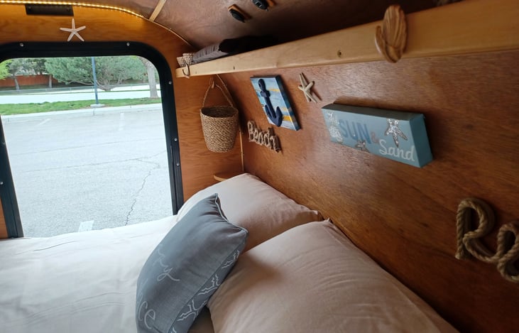 View of the head of the queen sized bed on the floor.