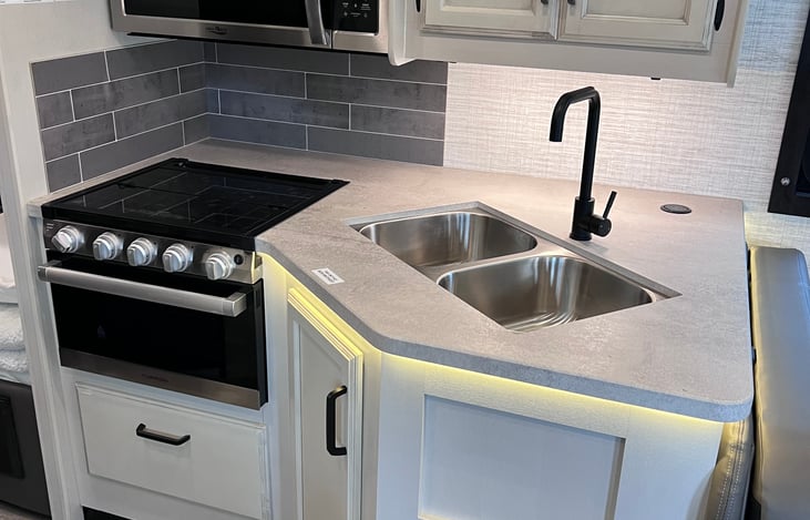 Kitchen with propane stove and microwave