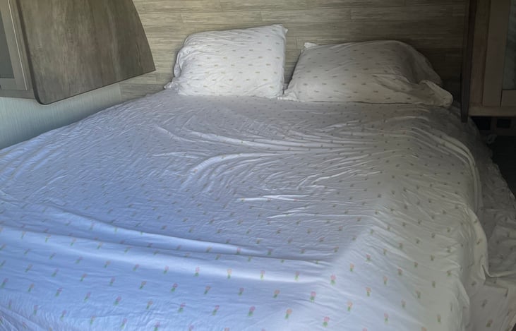 Master bedroom with the king size bed. The bed has 3 inch thick mattress padding