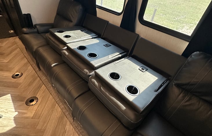 The middle couches fold down w/cup holders and USB plug in.
