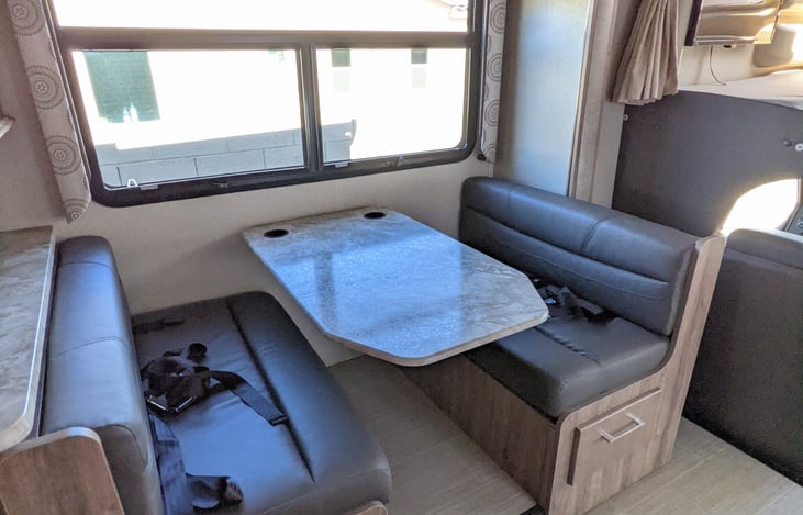 Table lowers and cushions fold out for a bed