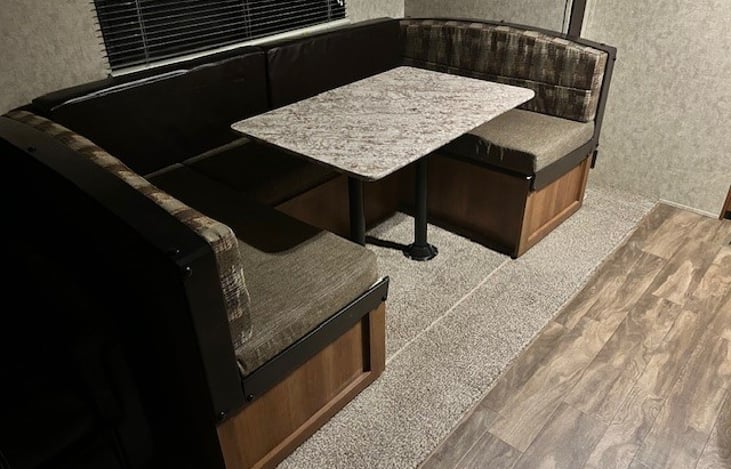 u-shaped table, coverts to sleeping area. 1-2