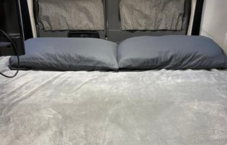 Comfortable King size bed in the rear. It can accomodate 2 adults and 1 small child. Please bring your own linen and pillow.