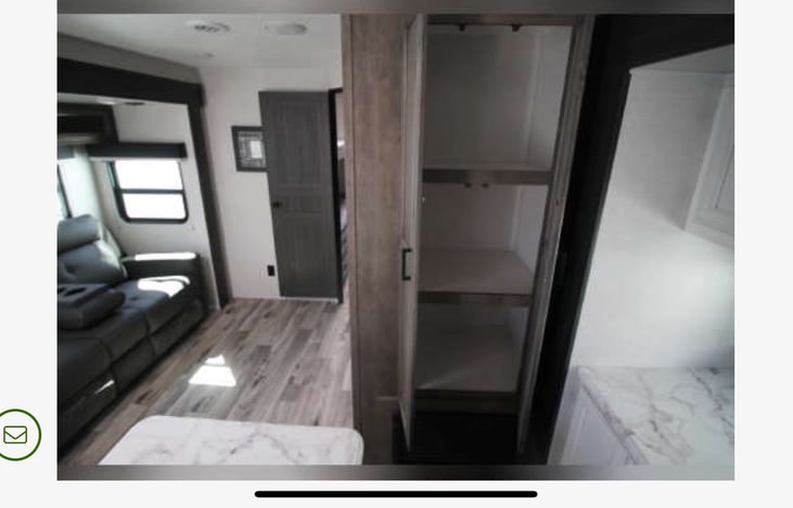 The pantry has plenty of room for groceries and other supplies.