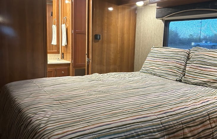 The Master suite offers a private full bath with tons of storage in addition to a comfy Queen size bed and plenty of overhead storage.