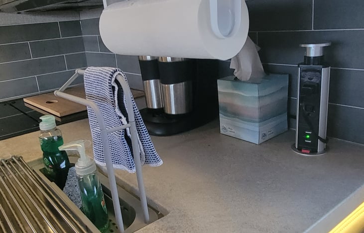 Coffee maker, paper towels, tissues, hand and dish soap and towels come included.