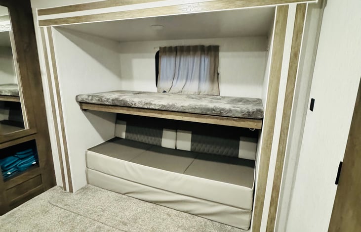 Twin size upper bunk and sofa that folds out to queen size bed