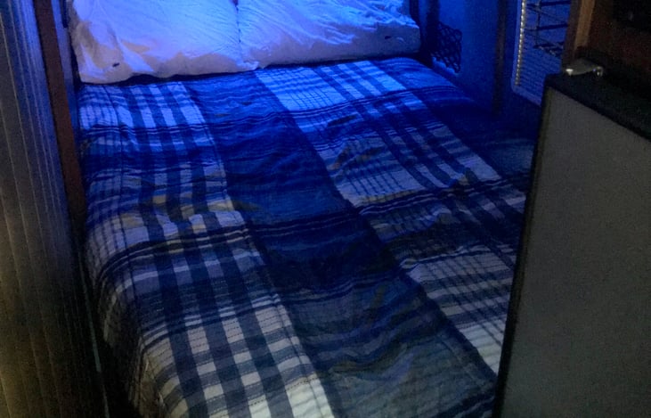 Blue night lights above bed