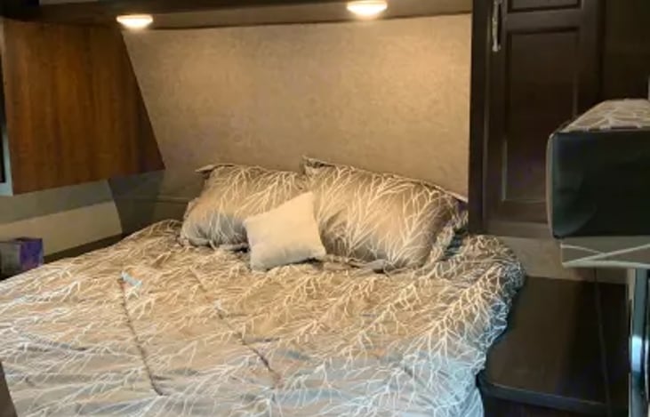 master, bed lifts up on struts for ease of reaching storage below.