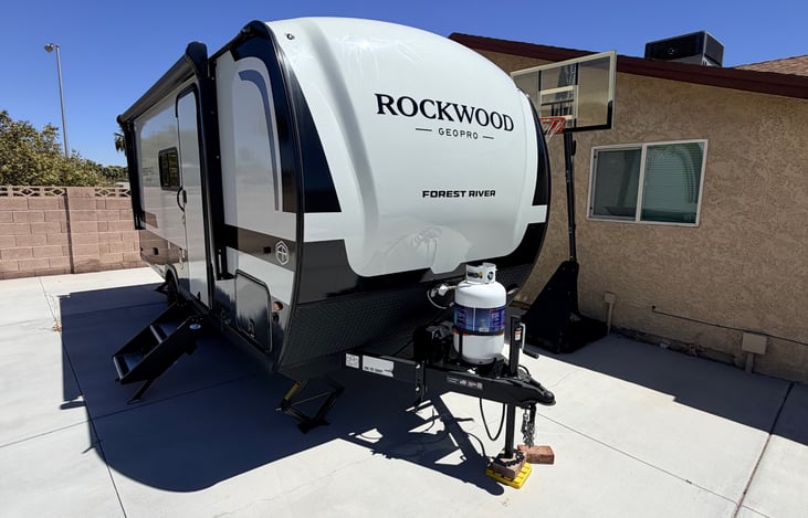 Propane tank and tongue jack up front. First time towing? We walk you through hitching at pickup.