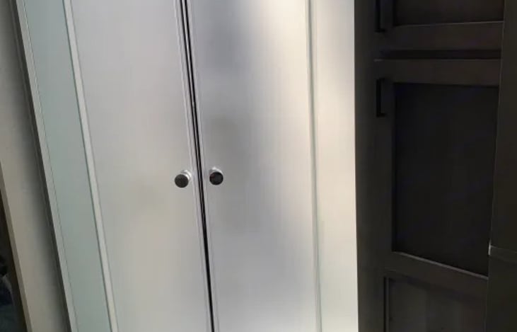 Glass radius shower with a skylight