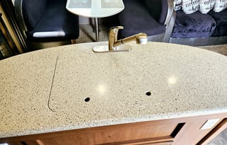 Large RV with outdoor kitchen, fireplace, and TVs