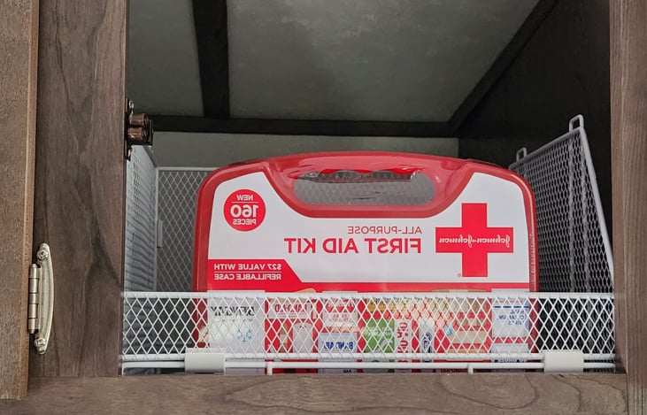 First Aid Kit in the cabinet above the television