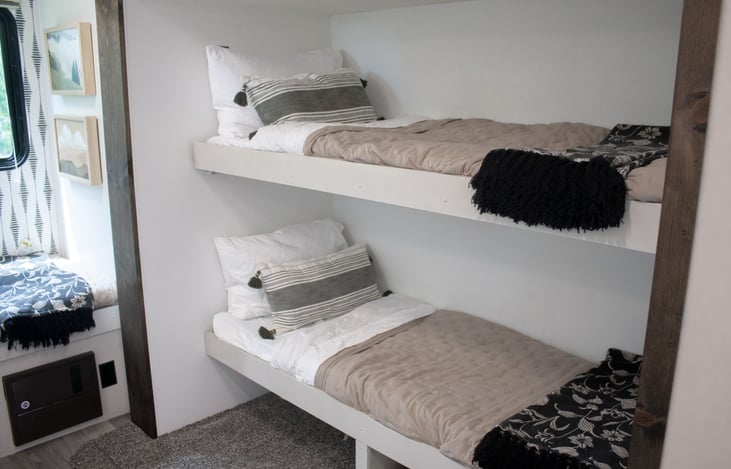 Four bunks with a sliding door to provide peace after hours.