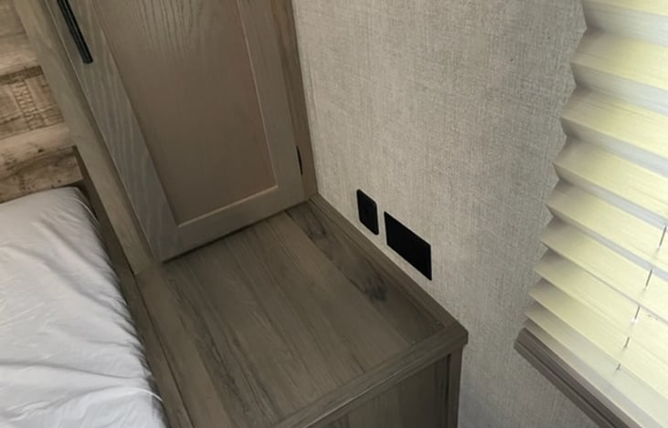 Close up view of the USB port and the plug in for the master bedroom.