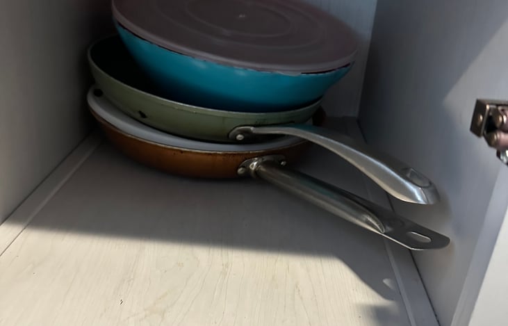 Pans, strainer and mixing/serving bowl.