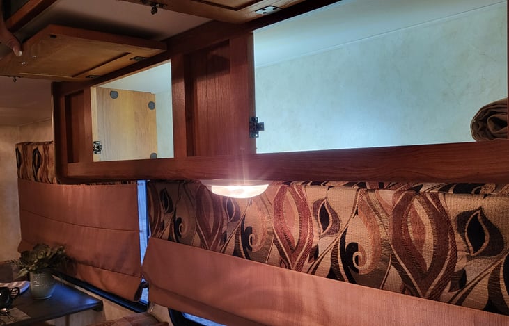 2 large storage cabinets over the sofa