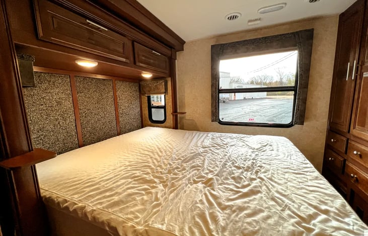 Queen size bed with TV