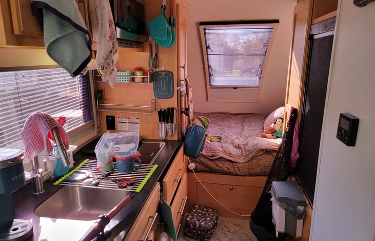 Kitchen area looking towards queen bed