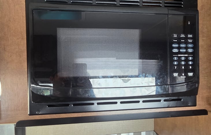 Kitchen: microwave that runs on electric or propane.
