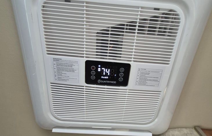 We have installed an ac that has a small condenser.  Cold air fills the cabin in short time. No generator needed, this ac runs on batteries. Turn the cab ac on for temps over 100 F. You will be chill.