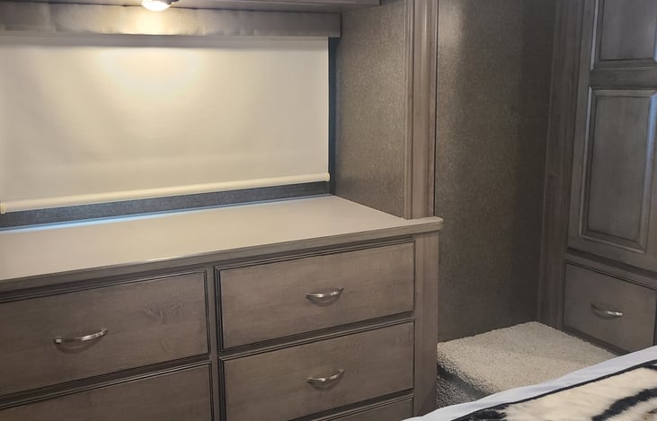 Six drawer dresser and emergency exit.