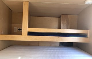 Cozy off-the-ground sleeper with kitchen