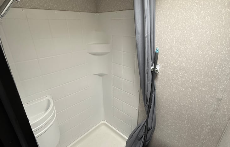 Large shower with bathroom sink as well