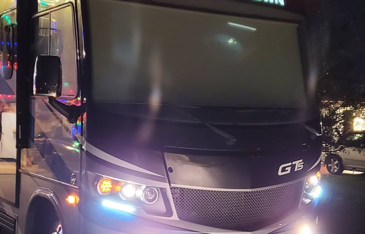 Close up of front with running lights, fog lights, and LED lights.