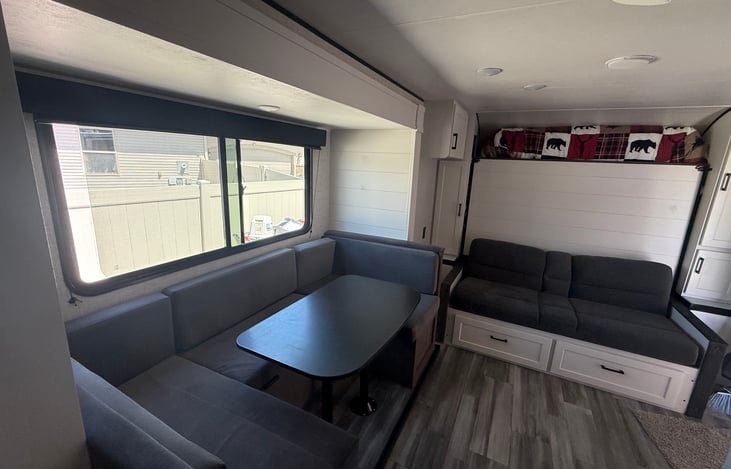 Sofa (has cup holders in center) Flatten sofa to drop down Murphy bed.