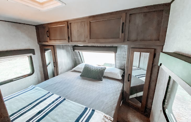 This room has a queen size memory foam bed with lots of storage for your clothing in the two wardrobes on either side of the bed and tons of additional storage above the bed.