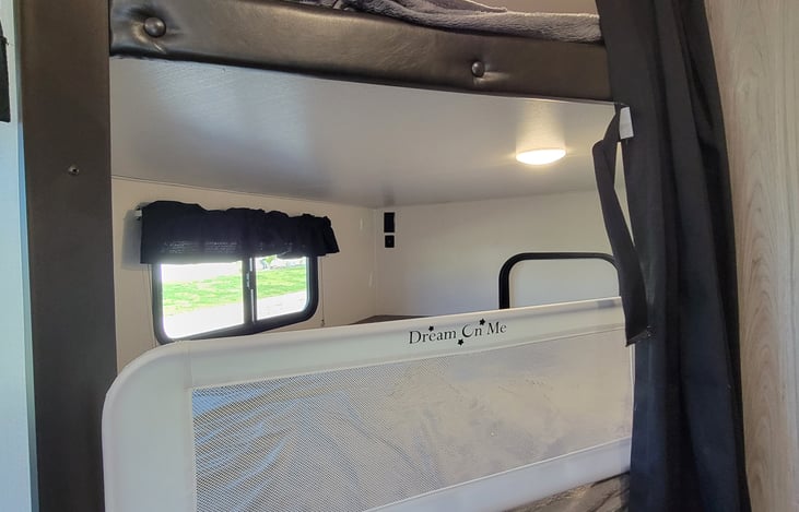 Lower bunk with bed rail for small children