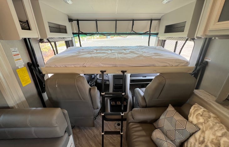 Drop down queen bed! Memory foam mattress topper to make it extra comfy