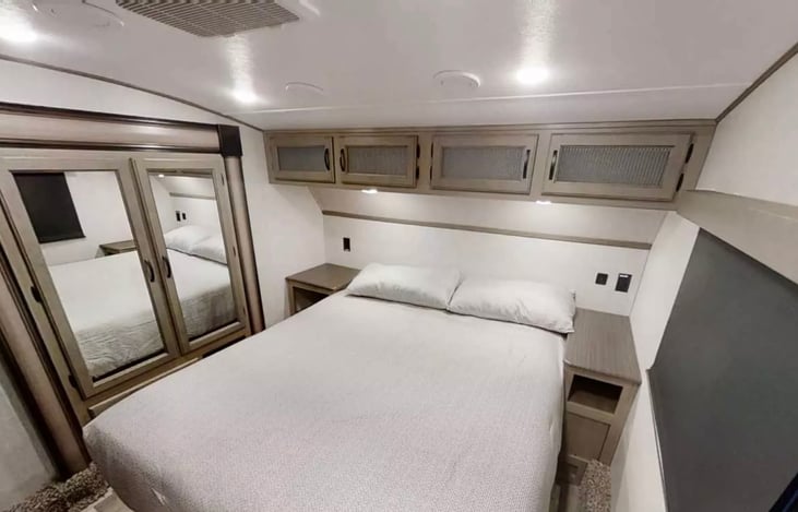 Master suite with 2 closets and over bed storage.