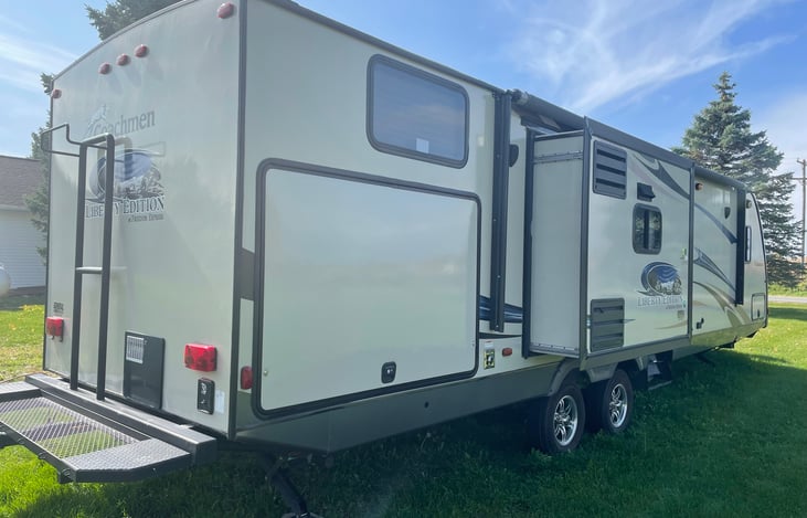 Bike and extra cargo rack on rear of camper.