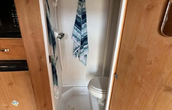 Enclosed shower and toilet